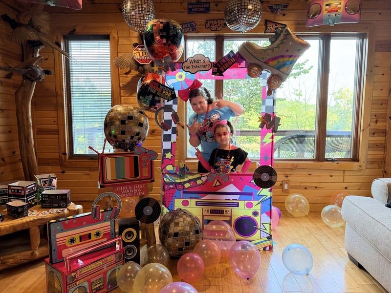 Colorful retro party frame with disco balls and bubble balloons